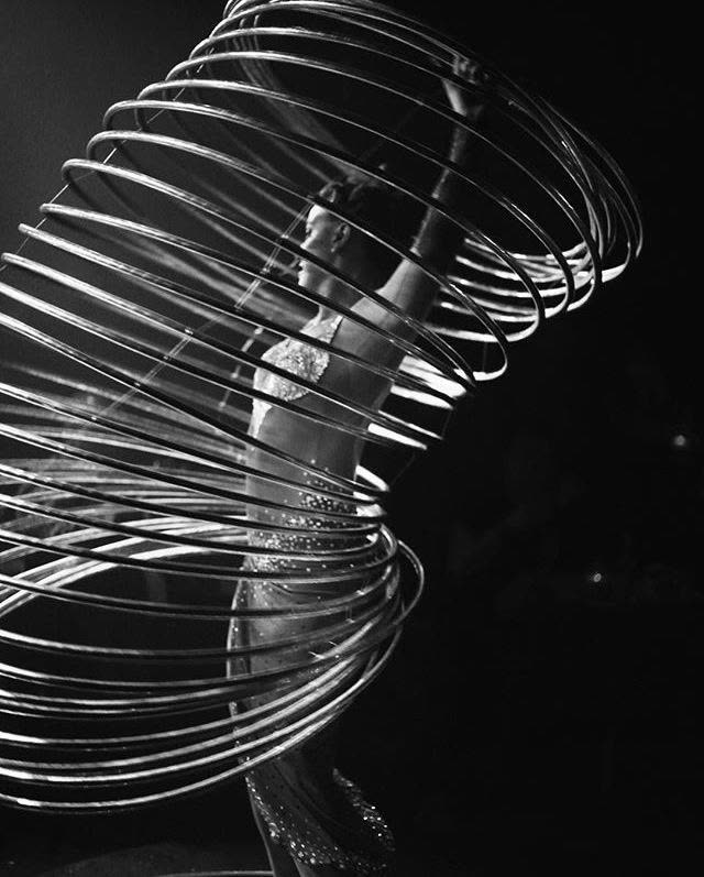 A metal hoop apparatus caught mid-spin